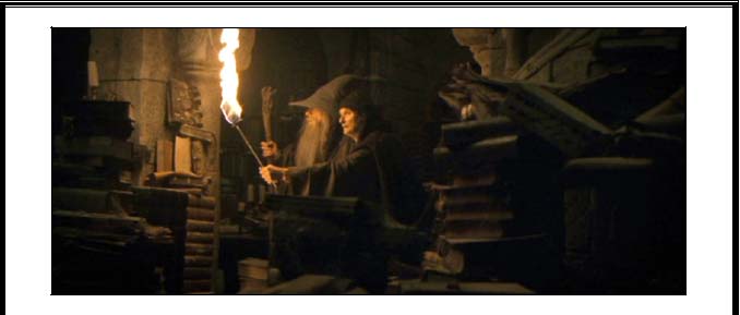 A dusty looking librarian and Gandalf